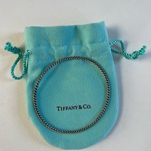 Tiffany’s sterling sliver twist bangle. In dust bag.